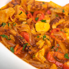 Recipe for octopus Provencal style, tomato, onion, garlic, red pepper, parsley, High quality photo
