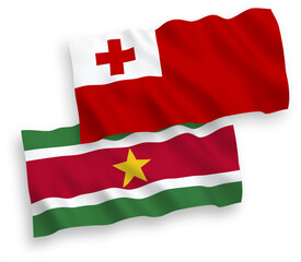 Flags of Kingdom of Tonga and Republic of Suriname on a white background