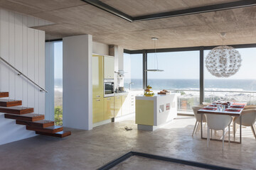 Fototapeta na wymiar Modern kitchen and dining room overlooking ocean