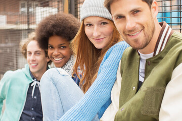 Friends smiling together outdoors