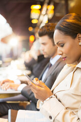 Business people working at sidewalk cafe