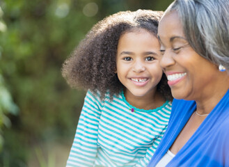 Close up portrait of happy granddaughter with grandmother