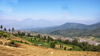Scenery of fertile land for plantations at the foot of the mountain