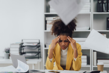 Asian woman Banshee has a headache due to working long hours without rest. Office Syndrome concept.
