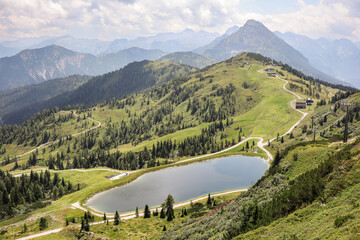Spectacular European Landscape of Green Hilly Mountains with Lake in Flachau. Scenic View of Alpine...