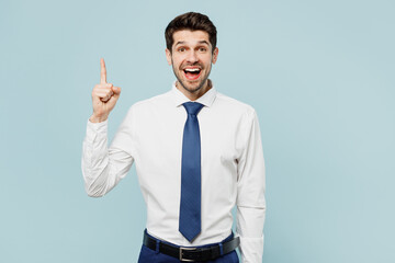 Young successful employee business man corporate lawyer wear classic formal shirt tie work in office holding index finger up with great new idea isolated on plain pastel light blue background studio.