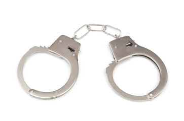 Close up of metallic handcuffs isolated on white background.