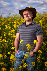 Farmer at canola plantation