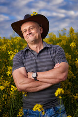 Farmer at canola plantation