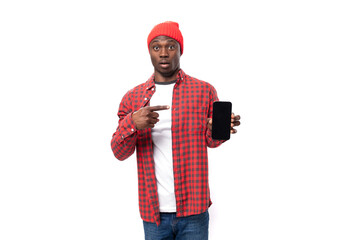 handsome young american man in red headwear showing advertisement on smafton with mockup on isolated white background with copy space