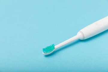 Sonic electric toothbrush on a blue background. Oral hygiene. Dental care. Dentistry concept. Place...