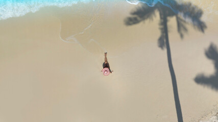 Fresh of summer with young woman  relaxation  as lying on the beach  in Maldives