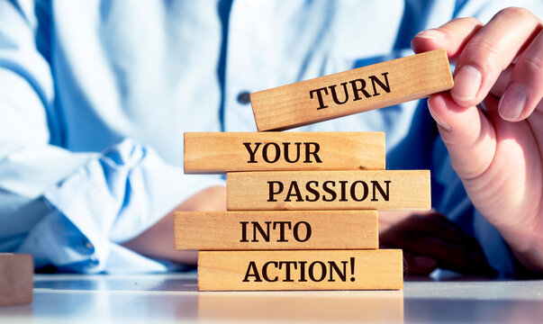 Close up on businessman holding a wooden block with a "Turn your passion into action" message