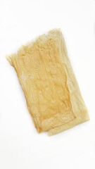 Beancurd tofu sheet or kembang tahu isolated on white background. Beancurd japanese, chinese and indonesia cuisine ingredient. Healthy food