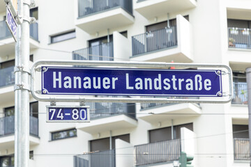 street sign Hanauer Landstrasse engl: road to Hanau -  - at blue enamel in Frankfurt