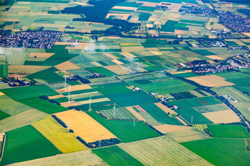 aerial of rural landscape in Bavaria near Aschaffenburg with green fields and electricity pylon,...