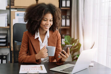 Business email marketing notification concept, Businesswoman use smartphone and laptop receive message alert in the mailbox and transfer data at home office.