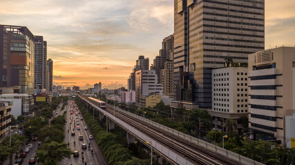 Aerial view of a subway train on a suspended railroad in Bangkok downtown, Sky train is fastest...