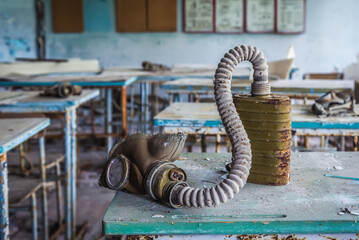 Gas mask in classroom in 2nd high school in Pripyat abandoned city, Chernobyl Exclusion Zone in...