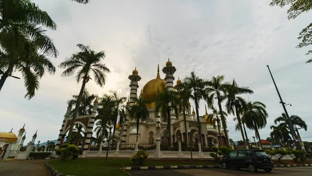 A Majestic Sunrise Illuminates the Serene Ubudiah Mosque in Kuala Kangsar