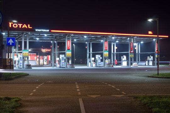 Arnhem, Netherlands - November 27, 2020: Total petrol station illuminated at night. Total SE is a French multinational integrated oil and gas company