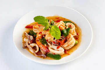 Stir Fried Basil with Seafood isolated on white background