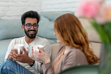 Married couple drinking coffeee, enjoying spending time together, relaxing, sweet tender moment.