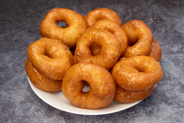 turkish donut ( lokma ) on the plate isolated