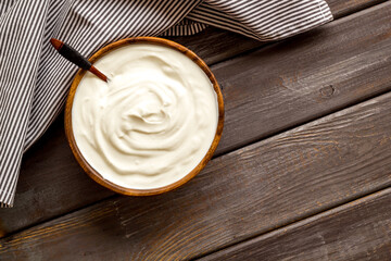 Bowl of sour cream or yogurt. Dairy product background
