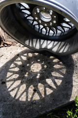 car wheels, titanium rims after a traffic accident are gray in the yard in the summer