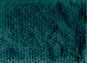 Grunge texture. Distressed bubble wrap. Gritty surface. Teal blue black color crumpled worn old plastic film on dark illustration abstract background.