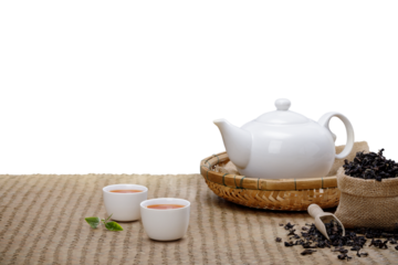 Tea cup with with steaming teapot on the wooden desk with transparent background png, Japanese style
