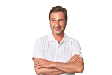 A middle-aged man isolated smiling confident with crossed arms.