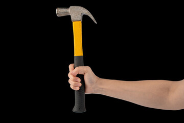 Hand with hammer on black background.