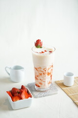 Strawberry smoothie or milkshake at white