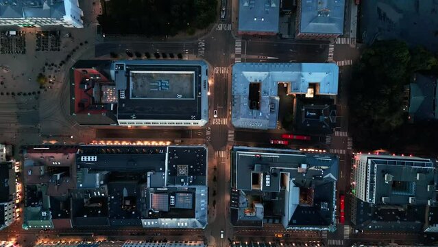 Oslo, Norway Night Time Aerial of central Oslo, city overview, cinematic architecture drone topview shot, streetlight glow, illuminated European city, 4k 60fps.