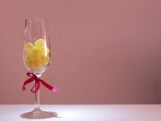 A glass with twelve lucky grapes