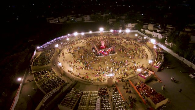 FPV Drone shot of Navratri festival. Navratri is an Indian Festival and It spans over nine nights. crowd in round shape