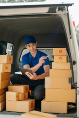 Portrait of courier delivery Asian man searching the address on digital tablet. Delivery service, delivery home and shipping concept..