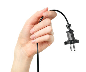 female hand holds a power cable with an electric plug on a white isolated background
