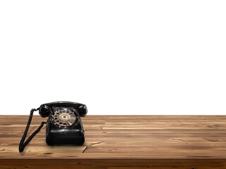 old black phone Placed on wooden table isolated on white background