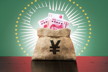  Chinese investment in the African economy. Money bag with yuan banknotes and  African Union flag.