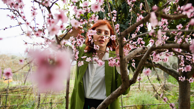 Girl near pink flowers Tree