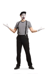 Full length portrait of a mime gesturing welcome
