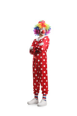 Clown in a red costume posing with folded arms