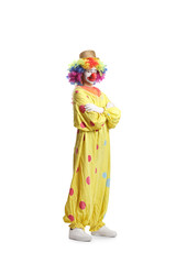 Clown in a yellow costume posing with folded arms