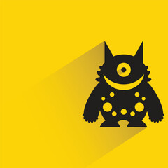 alien monster with shadow on yellow background