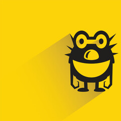 alien monster with shadow on yellow background