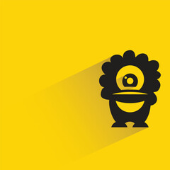 alien monster with shadow on yellow background