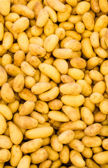 Crate of potatoes close-up on a market stall